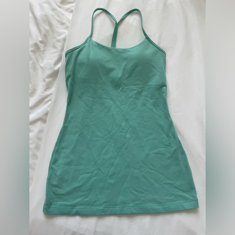Lululemon women athletic tank with built in tank. Waist length turquoise size 4